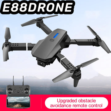 Black E88 Smart Camera Drone folded view with remote control and obstacle avoidance feature on a blue sky background