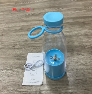 Blue Portable rechargeable USB blender on a wooden surface with a label indicating 'Blue 380ml'.
