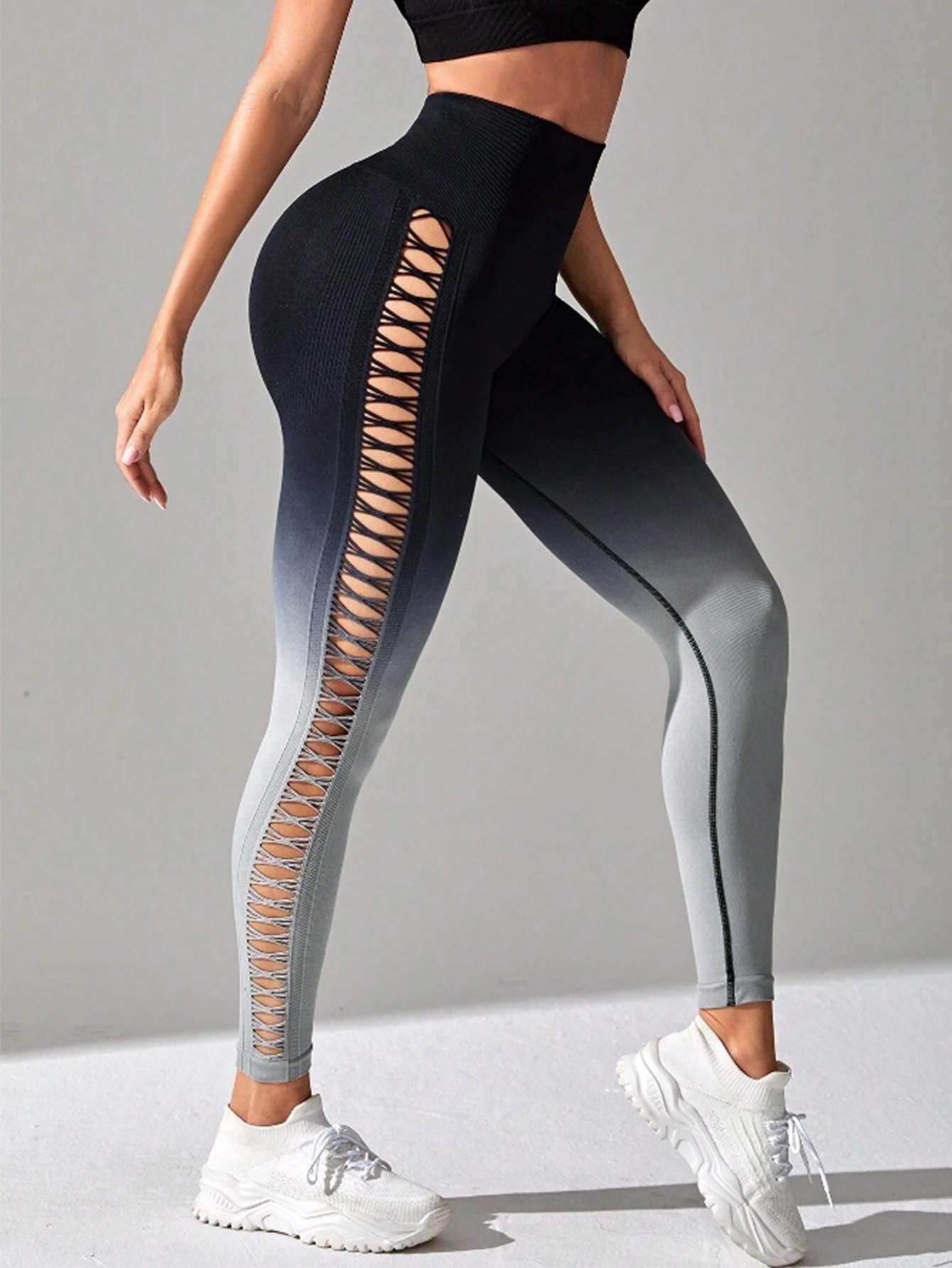 Black and gray gradient leggings with cut-out design on a gray background