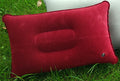 Red inflatable pillow on grass