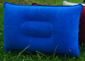 Blue inflatable pillow on grass