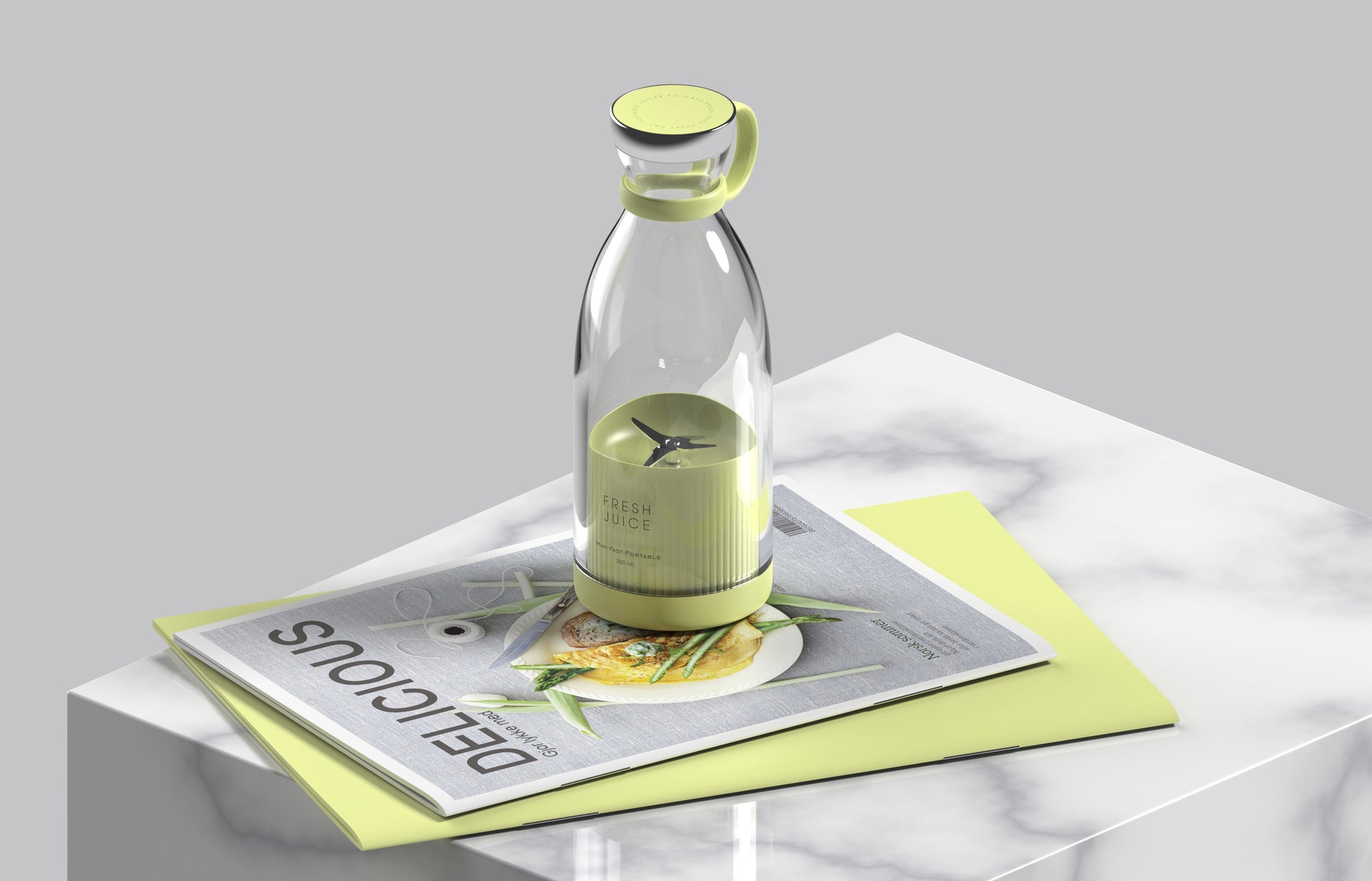 Clear Portable rechargeable USB blender with green label on a white surface with a magazine underneath