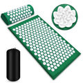 Green acupressure mat with white nodes and carrying bag on a white background