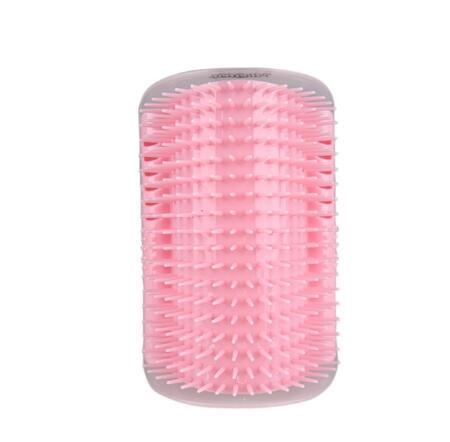 Pink cat grooming brush with bristles on a white background