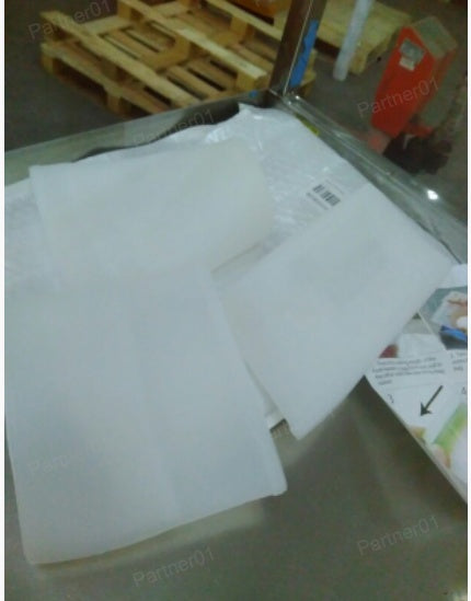 White envelopes on a glass surface with a blurred background