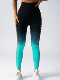 Black and blue gradient leggings with decorative side panels on a white background