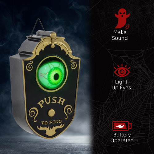 Halloween-themed doorbell with green eye and text 'Push to Ring' on a dark background.