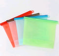 Set of colorful plastic bags on a white background; Leakproof silicone bag for meat, fruits, and vegetables