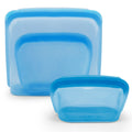 Set of blue silicone food containers on a white background