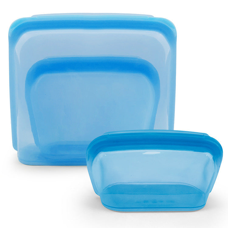 Set of blue silicone food containers on a white background