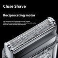 Close-up of a reciprocating motor for a shaving product with text on a black background; Rechargeable men’s grooming razor in ivory white with low-noise performance