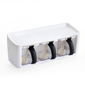 White and clear container with black handles on a white background