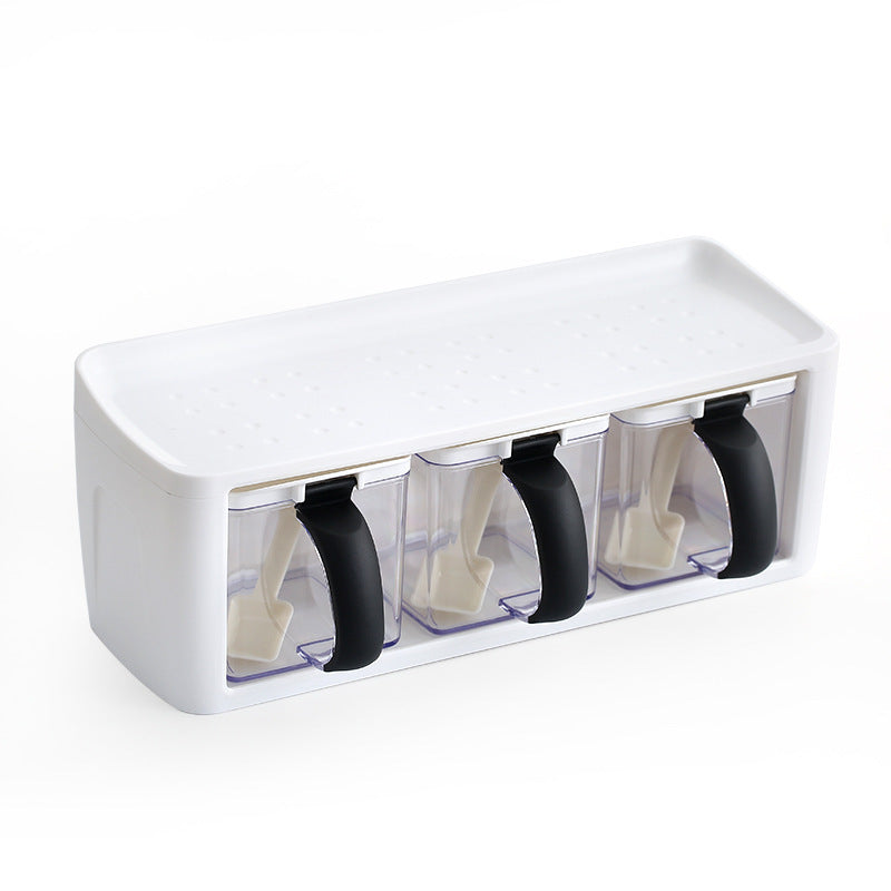White and clear container with black handles on a white background