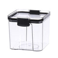 Clear storage container with black lid on a white background