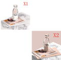 Two images of Portable rechargeable USB blender with a pink cap on a magazine with a marble surface.