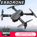 Black E88 Smart Camera Drone with remote control and obstacle avoidance feature on a clear sky background