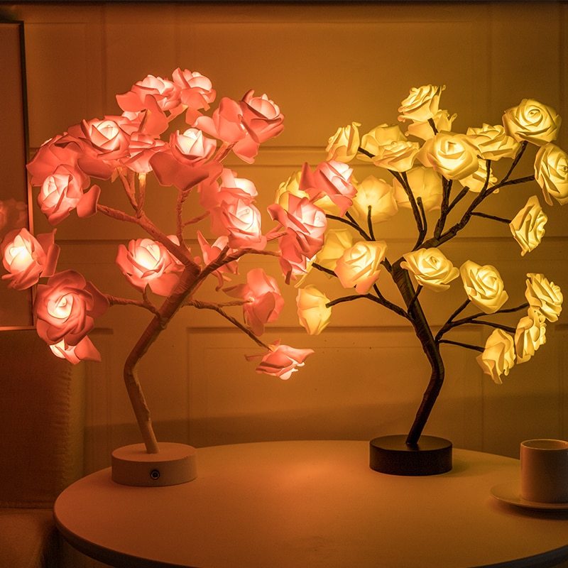 Two LED flower tree lamps on a table with a warm glow.