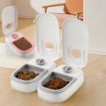 Automatic pet feeder and water dispenser for cats and dogs with a single extra feeder pink in color