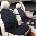 Black car seat covers with heating elements on a beige car interior.