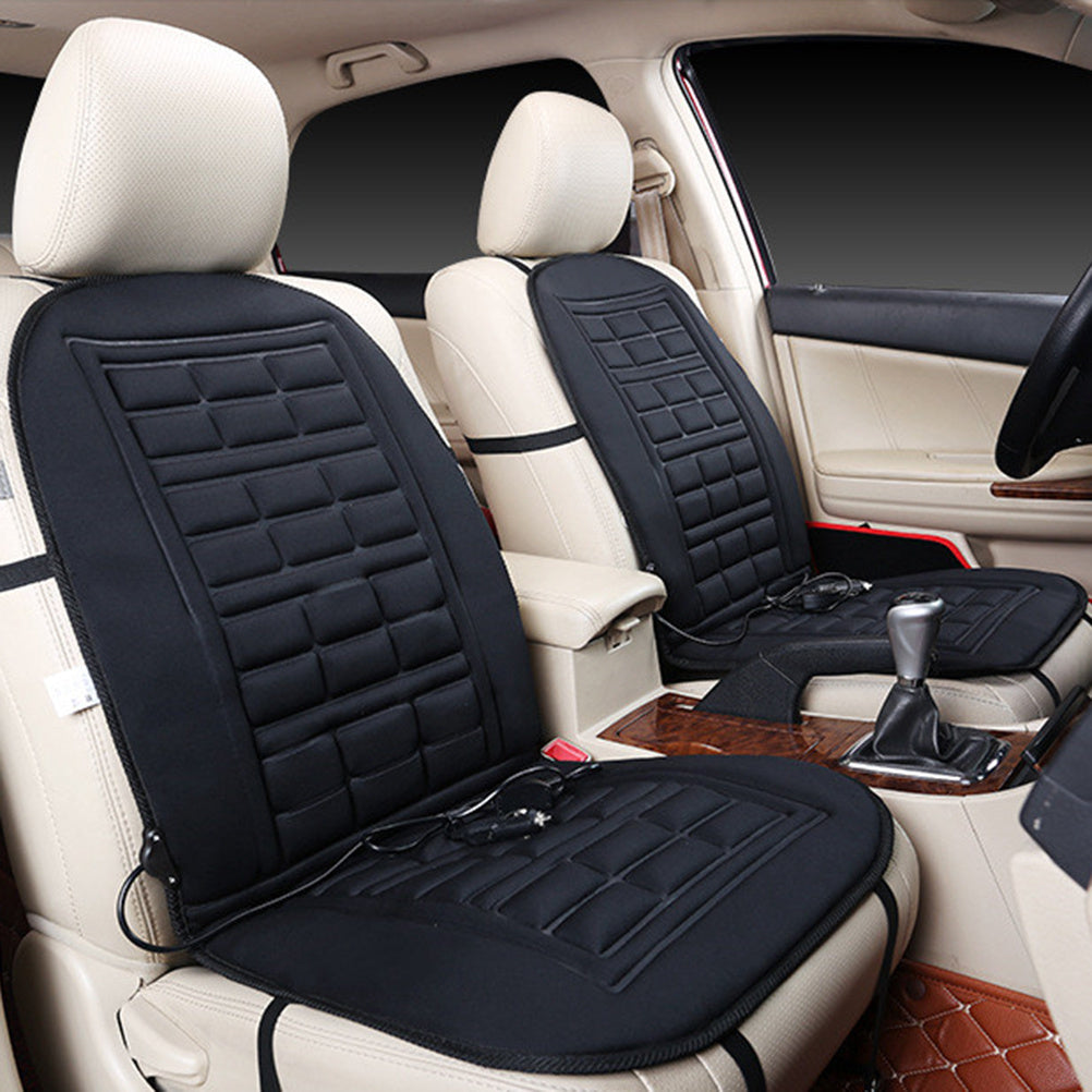 Black car seat covers with heating elements on a beige car interior.