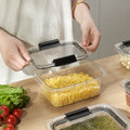Hands holding the compact bento box, demonstrating portability and daily usability