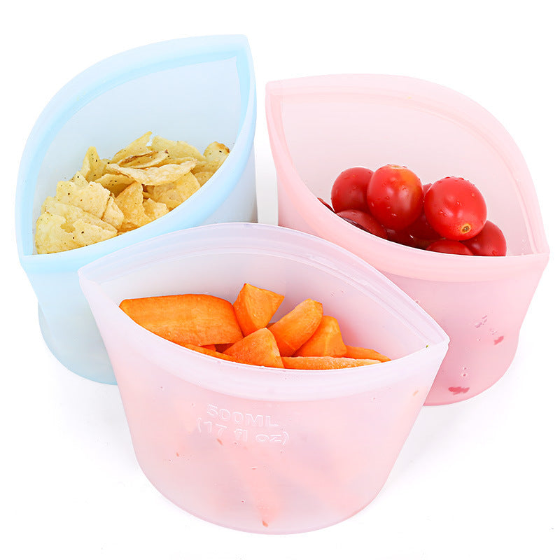 Set of 3 reusable silicone food storage bags in assorted sizes; Leakproof airtight silicone bags for kitchen storage; Transparent silicone food bags filled with fruits and vegetables; Microwave and freezer safe silicone fresh-keeping bags; Eco-friendly reusable silicone snack and meal prep bags
