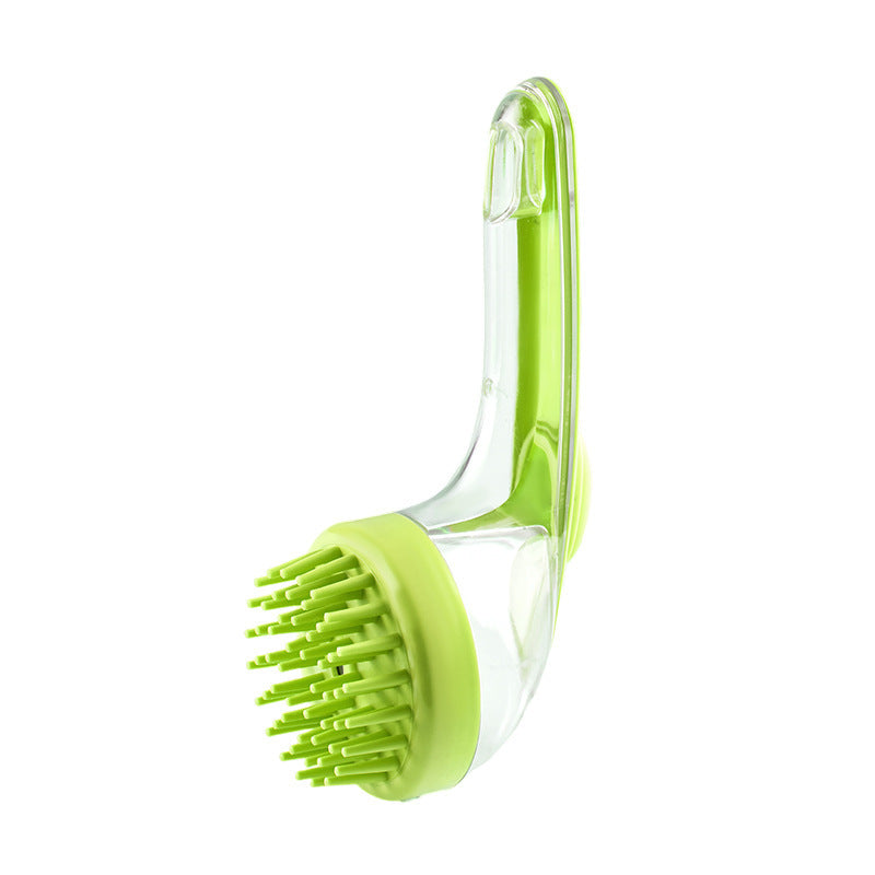 Green pet grooming brush with clear handle on a white background