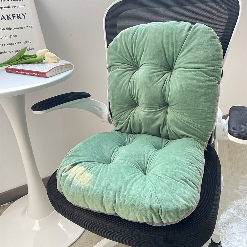 Green chair cushions on a black office chair with a table and tulips in the background; Ergonomic integrated office seat cushion with backrest in light gray viscose fabric