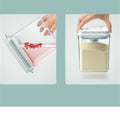 Two containers with lids, one holding flowers and the other holding a white powdery substance, on a light blue background