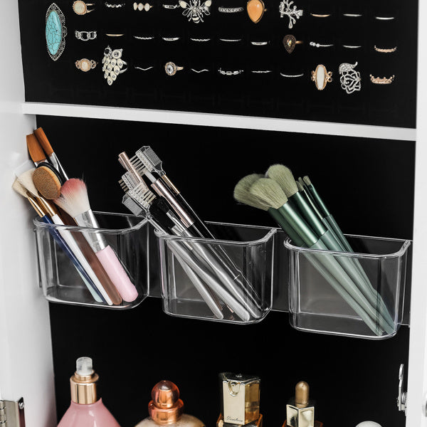 Clear plastic storage bins on a magnetic board with jewelry and makeup items.