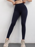 Person wearing black leggings against a white background