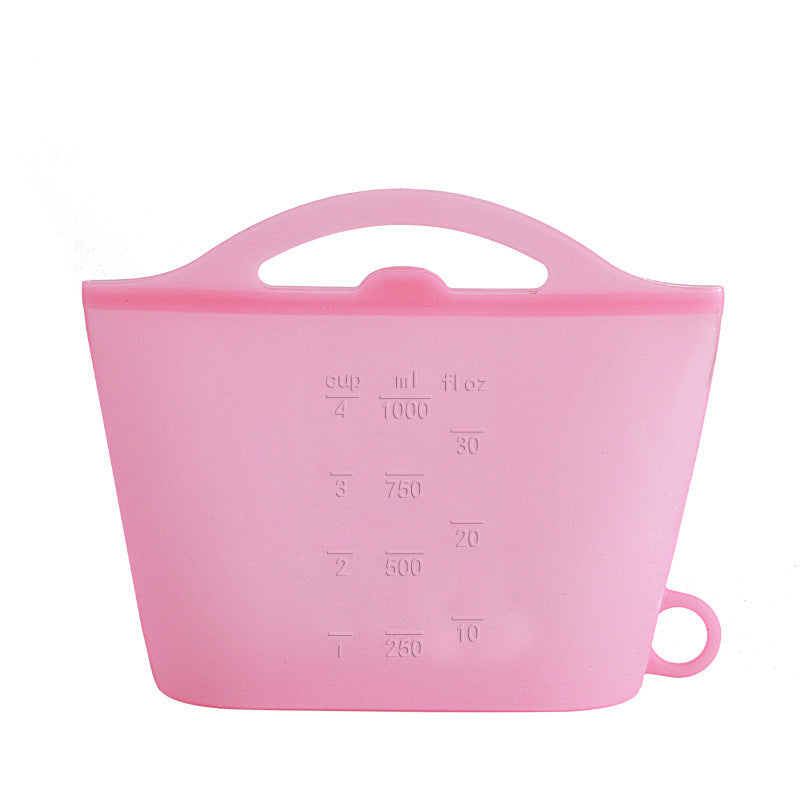 Pink silicone measuring cup with volume markings on a white background