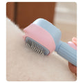 Pink and blue pet grooming brush being used on a dog's fur