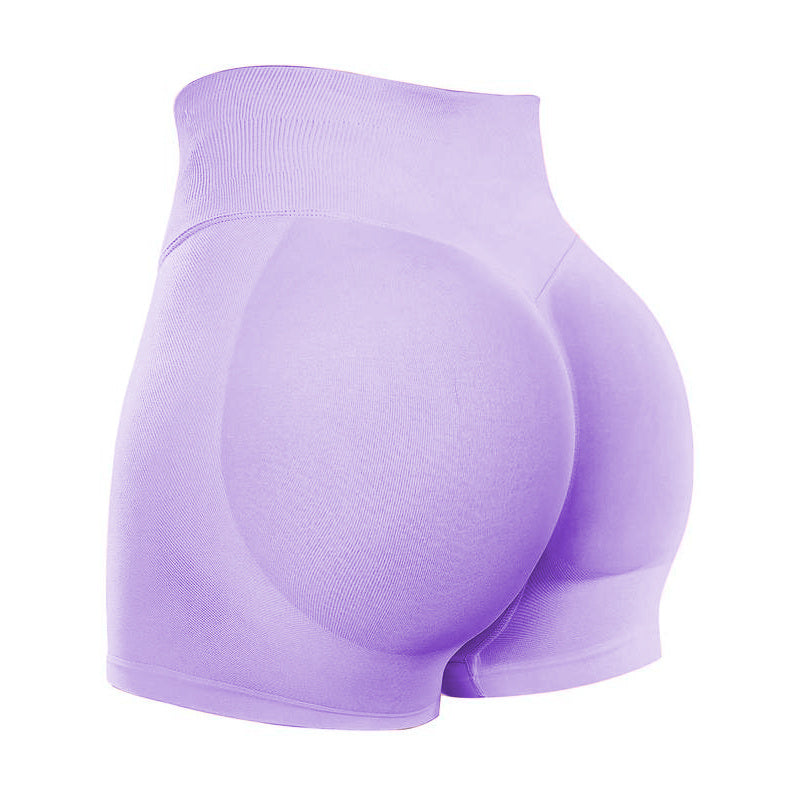 Purple athletic shorts on a white background