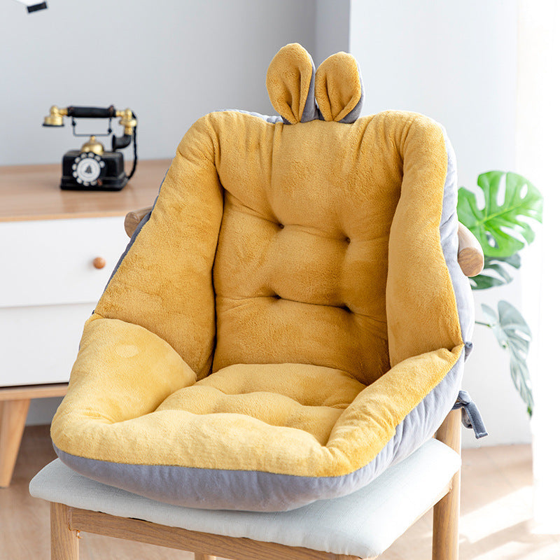 Yellow cushion with bunny ears on a chair in a room setting; Plush backrest-integrated chair cushion in neutral color