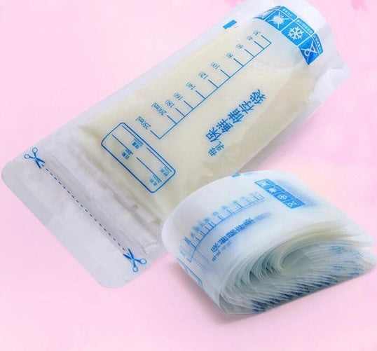 Roll of clear plastic bags with measurement markings on a pink background