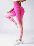 Pink leggings with mesh panels on a white background