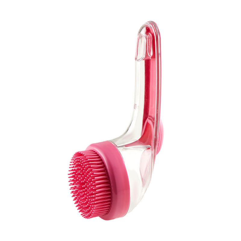 Long handle pink pet bath brush with clear handle on a white background