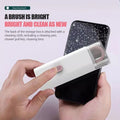Hand holding a smartphone with cleaning brush and storage box on a light pink background