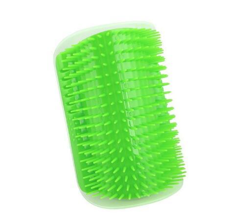 Green self cat grooming brush on a white background