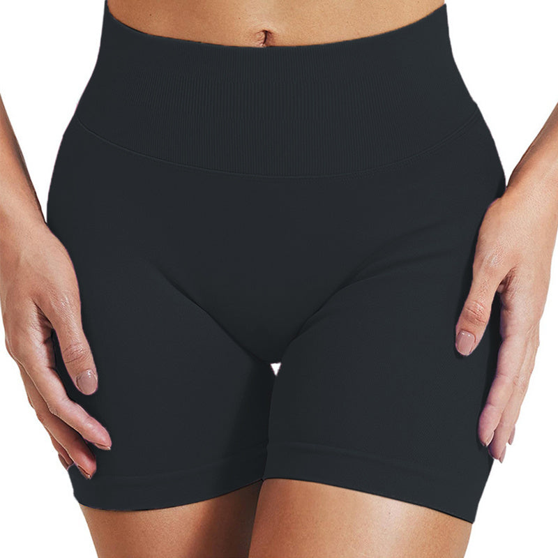 Black high-waisted shorts worn by a person on a white background; displayed folded on a flat surface