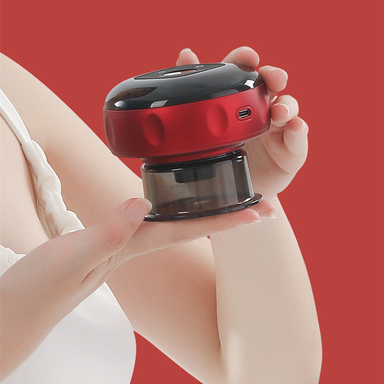 Hand holding a red and black electronic device against a red background