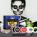 Halloween makeup palette with red, black, and white cream paints