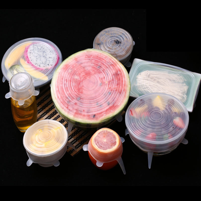 Silicone food covers on various fruits and containers against a black background; Silicone stretch lids reusable food cover set