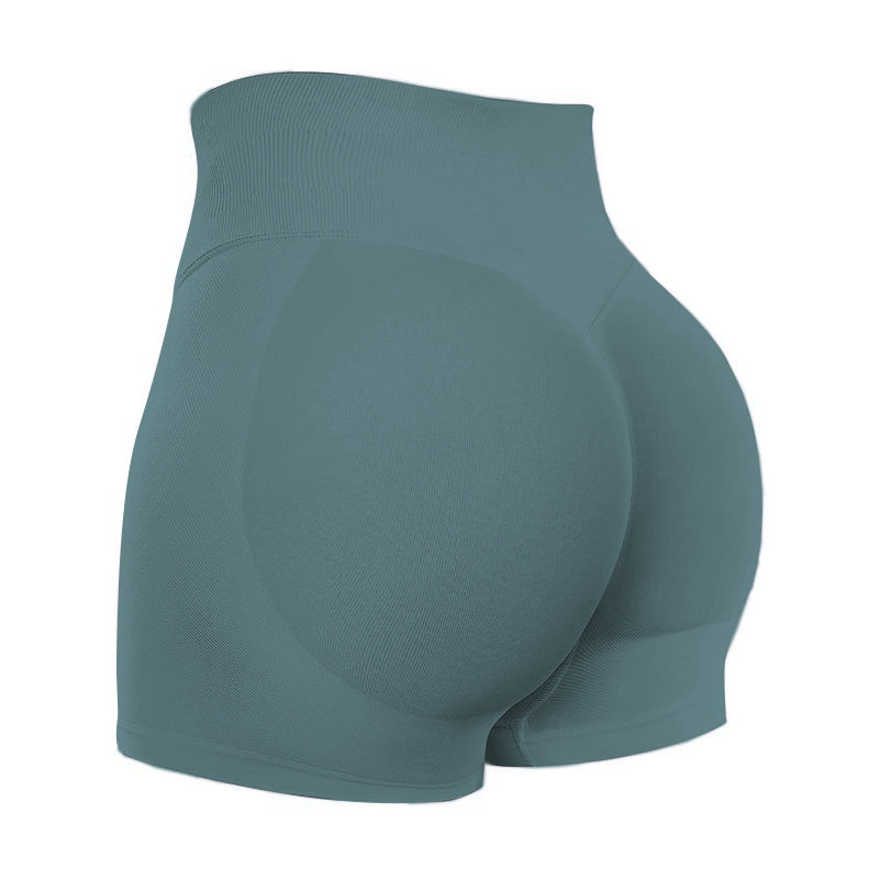 Teal athletic shorts on a white background