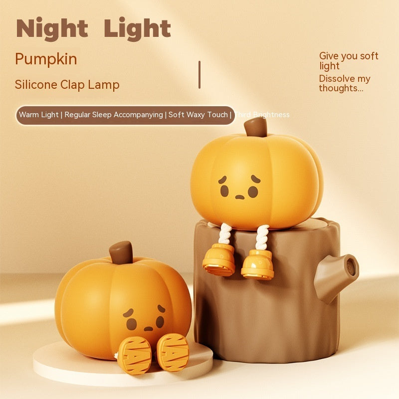 Pumpkin-shaped night light with a soft waxy touch on a beige background