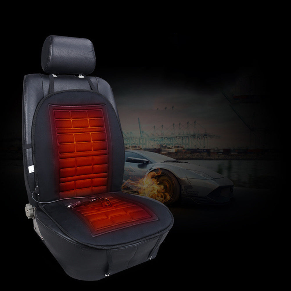 Car seat cover with heating pad glowing red, car in background