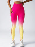 Gradient pink to yellow leggings worn by a person on a white background