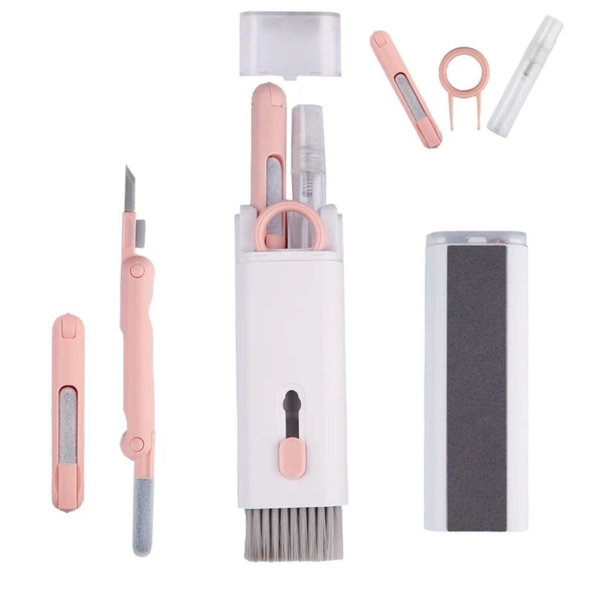 Set of pink and white skincare tools including a knife, comb, and other instruments on a white background.