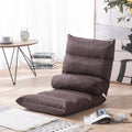 Brown floor pillow on a wooden floor with a table and books in the background; Foldable single lazy sofa recliner chair